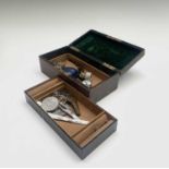 A jewel box and contents including a pair of gold faced silver cuff-links, a diamond ring (