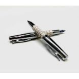 A Fabre Castell fountain pen in cream crocodile pattern with matching rollerball