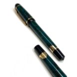 A green Waterman Phileas fountain pen and matching rollerball pen