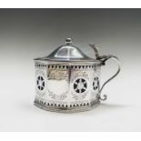 A large mustard pot of flattened octagonal form with bright cut and pieced decoration by CS Harris &