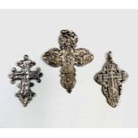 Three European silver crosses, the largest 65.6mm 37gm total