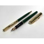 A Parker Insignia custom green fountain pen date code IIP and a matching ball pen code IY