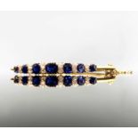 A dazzling sapphire and diamond early 20th century hinged gold bangle 12.1gm 60.6x48.7mm