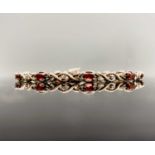 A 9ct gold diamond and ruby bracelet 5.5gm