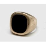 A 9ct gold signet ring set with black onyx 8.6gm