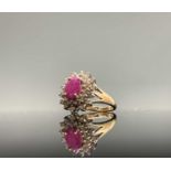A 9ct gold ring with an oval ruby and diamond cluster 3.6gmCondition report: Ring size O, One