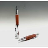 A Fabre Castell fountain pen with wood barrel and with matching ballpoint