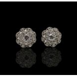 A pair of Belle Epoch diamond set discus earrings the stones with a total weight of 1.34ct 5.8gm Dia