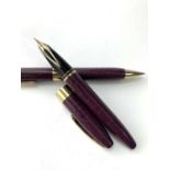 A Scheaffer Legacy Leather burgandy fountain pen with 18ct gold nib and matching ballpoint pen