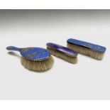 A pair of unusual Chinoiserie enamelled silver brushes each with pale blue ground by Henry