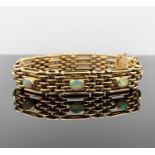 A 9ct gold four-bar gate-link bracelet mounted with nine opals15gmCondition report: Approx length