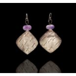 A pair of Breon O'Casey silver and stone earrings, each has an amethyst bead over a textured