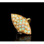 An 18ct gold navette ring, pave set with opals 6.2gm