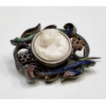 An Art Nouveau silver brooch with micro-mosaic scrolls and a carved white coral cameo 3.3cm wide 7.