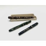 A Conway Stewart Dinkie 550 fountain pen with 14ct nib (boxed) and another Dinkie 540 with 14ct