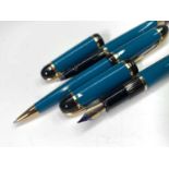 A turquoise Waterman Phileas fountain pen, matching rollerball pen and matching ballpoint