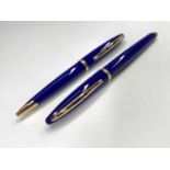 A Waterman Careine blue fountain pen with 18ct gold nib and a matching ballpoint pen