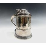 A George II English silver straight-tapered armorial tankard by John Fossey with a double domed