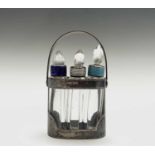 An early George VI perfume set with three cut glass bottles each with harlequin enamelled silver