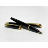 A Parker Ellipse black fountain pen with 18ct medium nib date code Q Pen only with an empty