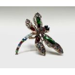 A kitch costume jewellery dragonfly brooch set with red, green and multicoloured crystals.