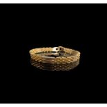 An 18ct gold bracelet 25.6gm Length 21.5cm