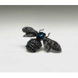 A kitch costume jewellery bumblebee brooch set with black, navy and peacock blue crystals.Wingspan