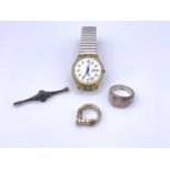 A high purity gold craft ring set a moonstone 11.6gm (tests as 18ct), a Swatch watch, a heavy silver