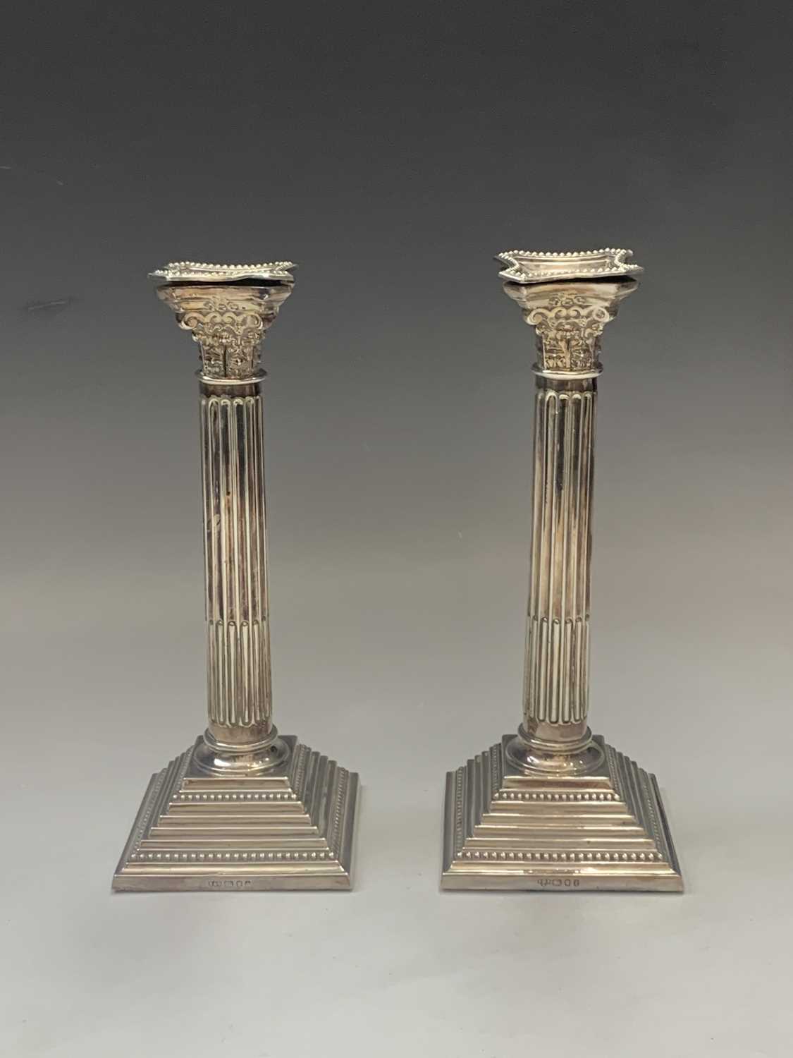 A pair of filled silver classical column candlesticks London 1974 Ht 25.5cmCondition report: Good