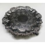 A William IV Silver Salver with scrolling acanthus leaf and floral decoration on three cast feet