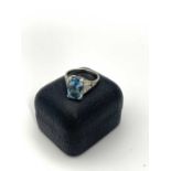 A white gold aquamarine (of over 4ct) and diamond ring. 5.8gm