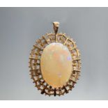 A 9ct gold opal set pendant 8.9gm (the stone 24.7 x 17.2mm)