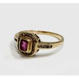An 18ct gold ruby and diamond square cluster ring 3gmCondition report: Size Q-Q1/2. Ruby of good
