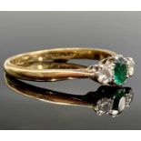 An 18ct gold ring set an emerald and two diamondsCondition report: Needs a clean but settings secure