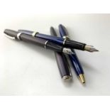 A blue Scheaffer Prelude fountain pen and matching ballpoint and a similar pair in matte mauve.
