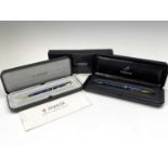 A Parker blue Insignia fountain pen, cased and a matching ballpoint also cased