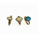 Three gold rings each with an oval opal 7.9gmCondition report: Approx sizes, largest stone first: