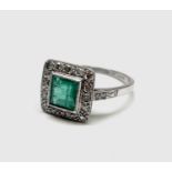 A platinum emerald and diamond square ring 4.2gm