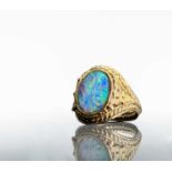 A gold ring with an opal in ornate pierced and rope-twist setting 5.2gmCondition report: 12.5 x 10.