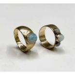 An 18ct gold ring collet set with an opal 6.1gm and a gold ring collet set with three opals