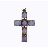 A 9ct gold cross set with six opals 39mm 5.3gm