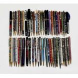 A large collection of fountain and ballpoint pens, including cloisonne
