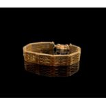 A 9ct gold fretwork link bracelet 28.1gm