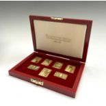 A set of seven silver-gilt replica stamps- 25th coronation anniversary 1978 173gm