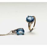 A 9ct gold blue topaz and diamond ring together with a matching pendant and chain 4.2gmCondition