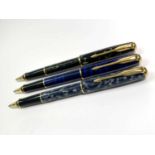 Three Parker Sonnet rollerball pens various colours and dates each with medium blue cartridge Pens