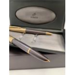 A Parker 100 Smoke Bronze fountain pen date code I111 and a matching ball pen code L cased and boxed