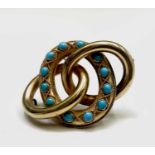 A Victorian gold triple ring turquoise set brooch 12.6gmCondition report: Electronic test suggests