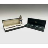 A Carrs hallmarked silver Concorde luggage label (boxed) and two Concorde complimentary pens by