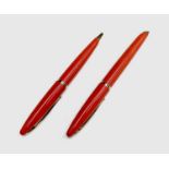 A Waterman Careine red fountain pen with 18ct gold nib and a matching ballpoint pen
